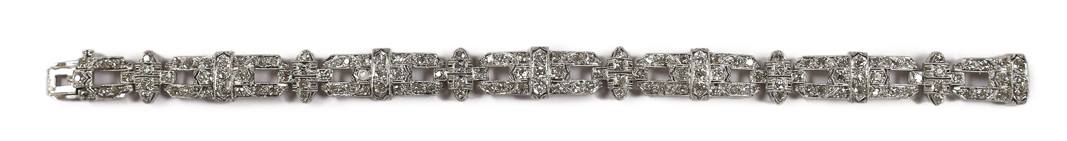 An Art Deco style pierced platinum and diamond cluster set bracelet